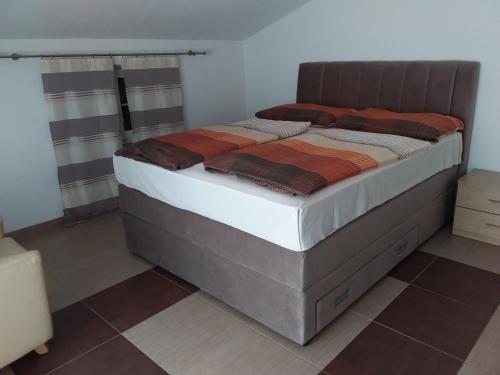 Postel nebo postele na pokoji v ubytování House apartments Ariamare