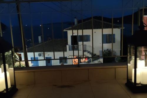 a view of a building from a balcony at night at Sissy Villas 2 in Poros Lefkadas