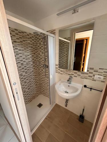 a bathroom with a sink and a mirror at LB Guest House in Tagliacozzo