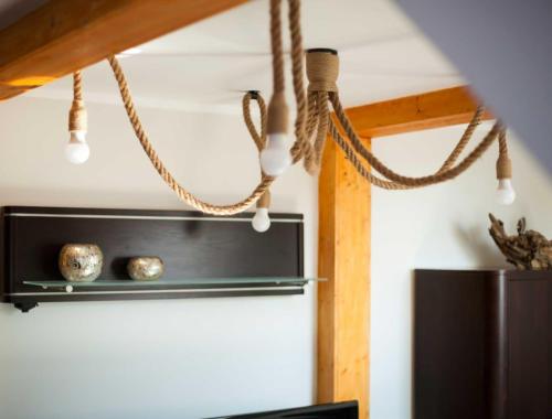 a kitchen with ropes hanging from the ceiling at FeWoNeustadt-02 in Neustadt in Holstein