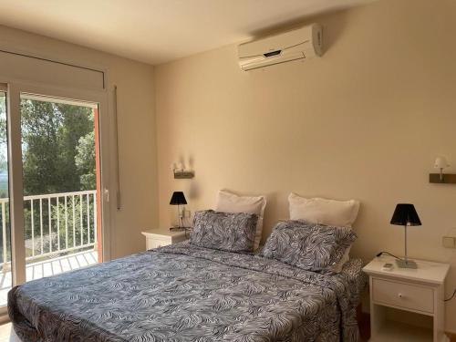 Postel nebo postele na pokoji v ubytování Casa Bosc (Residencial Begur)