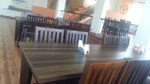 a wooden table with a napkin on top of it at HillTop in greany meadows yercaud in Yercaud