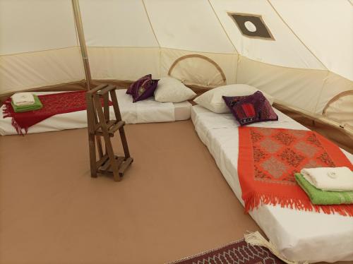 a room with two beds in a tent at Barrieh in Rammūn