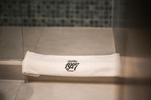 a white towel sitting on a bath tub at Villa 1927 in Belgrade