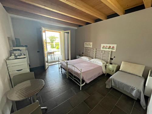 Katil atau katil-katil dalam bilik di Agriturismo scannaporco