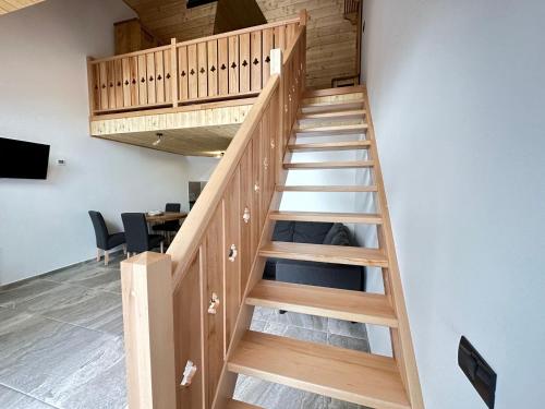 a staircase leading up to the second floor of a building at A Frame Chalet By Superski in Cavnic