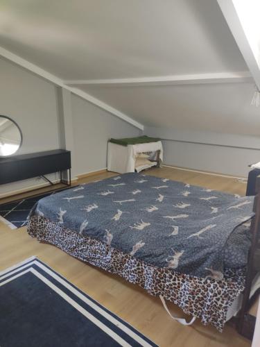 a bedroom with a bed in a attic at Özel Villa in Sarıyer