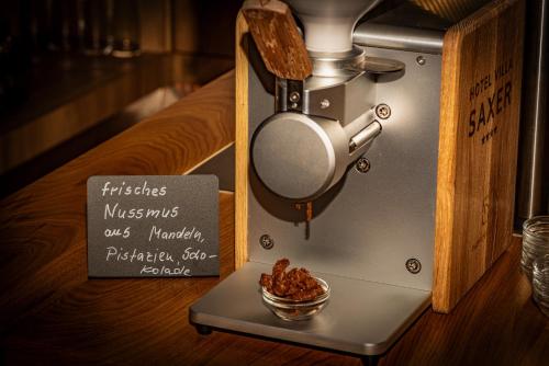 a machine with a bowl of food on a table at AKZENT Hotel Villa Saxer in Goslar