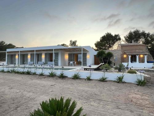a villa with a view of a house at Casa Casita in Cala Saona