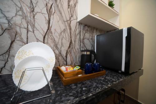 Una cocina o zona de cocina en MURALI KRISHNA APART HOTEL