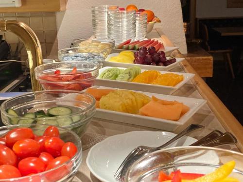 a table with different types of fruits and vegetables at Hotel Gsallbach in Kaunertal