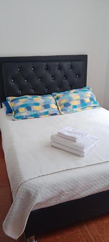 Postel nebo postele na pokoji v ubytování Dulce hogar baño compartido