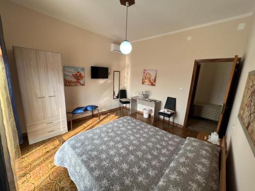 a bedroom with a bed and a mirror at B&B EMPIRA Lamezia Terme in Lamezia Terme