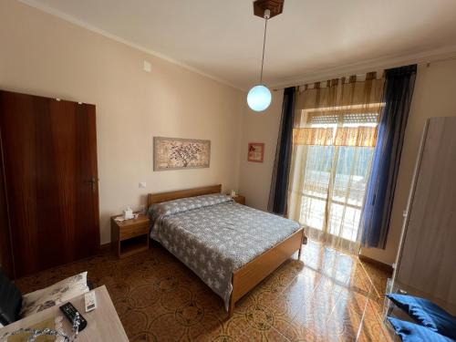 Postel nebo postele na pokoji v ubytování B&B EMPIRA Lamezia Terme