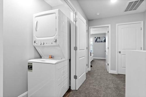 a white room with a washer and dryer in it at Stay Happy in Clarksville