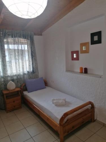 Ένα ή περισσότερα κρεβάτια σε δωμάτιο στο Tota's Family House
