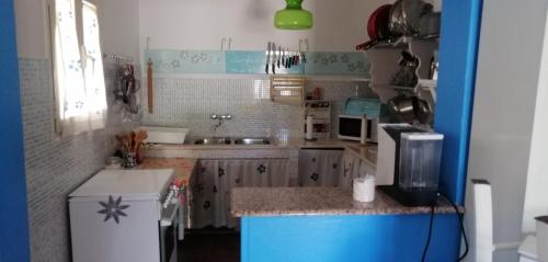 a kitchen with a sink and a counter top at Casa Vacanza La Crava in Sava