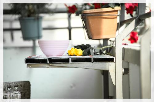 a table with a bowl and a plate on it at Your Place By The Lake - near Leonardo Academy, MXP in Sesto Calende