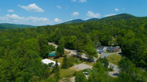 an aerial view of a building in the middle of a forest at Christmas Farm Inn and Spa in Jackson