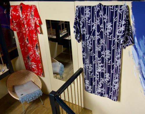 a room with two shirts hanging on a wall at The Sunday Schoolroom in Sherborne