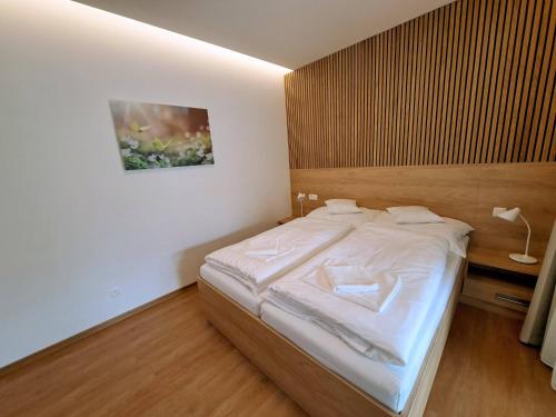 Postel nebo postele na pokoji v ubytování 6bits Apartments