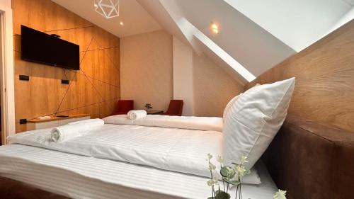 Cama ou camas em um quarto em Luna penthouse