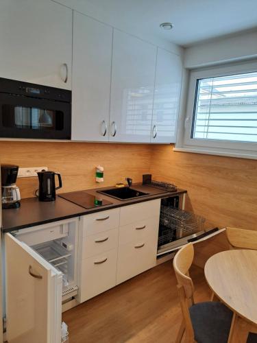 Kuchyň nebo kuchyňský kout v ubytování 6bits Apartments