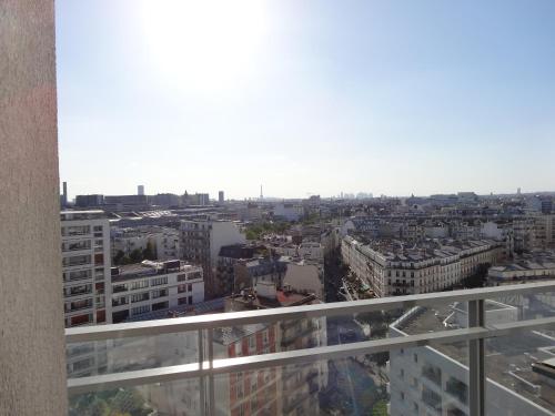 a view of a city from the balcony of a building at Jennifer in Paris