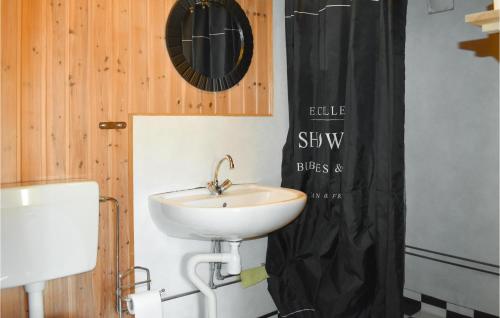 a bathroom with a sink and a mirror on the wall at Beautiful Home In Backaryd With 2 Bedrooms in Backaryd