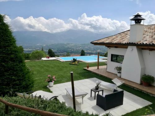 a backyard with a pool and a house at Bellavista B&B di Charme in Macchiagodena