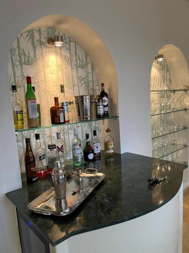 a bar with a counter with bottles of alcohol at Unique, luxurious coastal villa in beautiful Anidri, Paleochora in Palaiochora