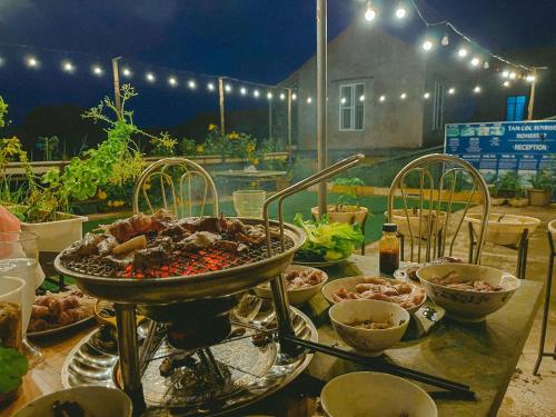 a table with a bunch of food on it at Tam Coc Sunrise Homestay in Ninh Binh