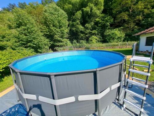 a large pool with a ladder around it at Vitez Koja in Vrnjačka Banja