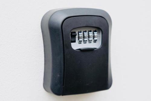 a black remote control sitting on top of a wall at ŠUMAVSKÝ DVŮR in Sušice