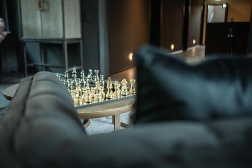 a living room with a chess set on a table at Sellmann´s Boutique Hotel in Dortmund