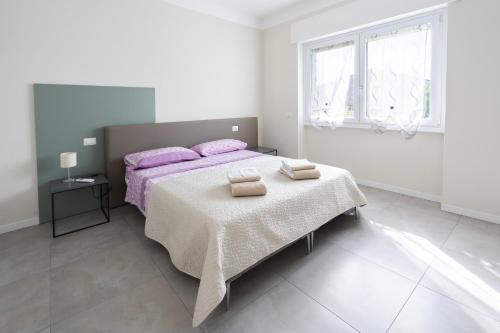 Ένα ή περισσότερα κρεβάτια σε δωμάτιο στο Borgo alla Pieve Apartments