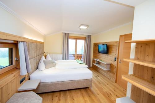 Postel nebo postele na pokoji v ubytování Aparthotel Ramsau