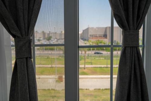 a window with a view of a city at Villa 55 in 6th Of October