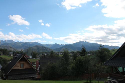 a view of the mountains from a house at Domek góralski Zakopane in Zakopane