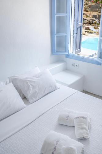 Ένα ή περισσότερα κρεβάτια σε δωμάτιο στο Nama Villas 