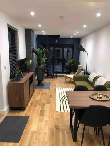 a living room with a couch and a table at The Old Bakery, NEC, BHX, HS2, Birmingham in Birmingham