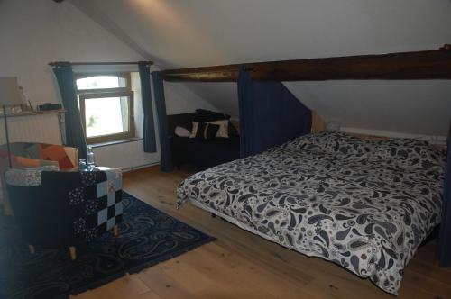 Tempat tidur dalam kamar di Le Buisson B&B