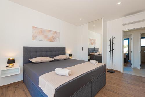 En eller flere senge i et værelse på Villa Katarina Vodice