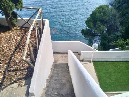a stairway leading down to the ocean from a house at Villa Paradise (Amalfi Coast - Luxury Home - Beach) in Vietri sul Mare