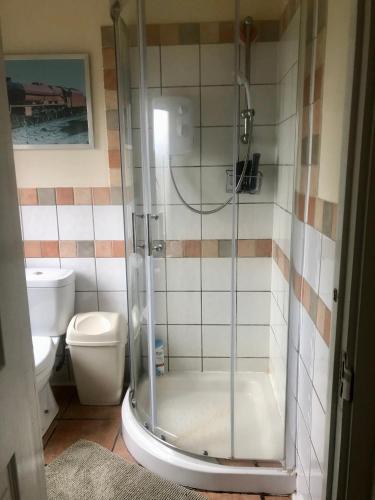 a bathroom with a shower and a toilet at The Old Station House in Retford