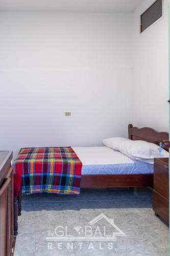 Un ou plusieurs lits dans un hébergement de l'établissement Sandalio Hostal Cali