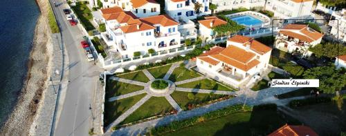 an aerial view of a large house with a yard at Studios Elpiniki in Skopelos Town