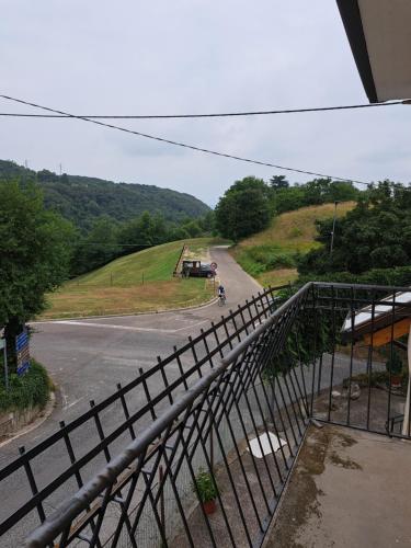 a view from a balcony of a road with a motorcycle at CASA BEDIN in Zovencedo