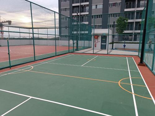 a tennis court in a building with at Aisy Homestay Putrajaya Cyberjaya KLIA in Kampung Dengkil
