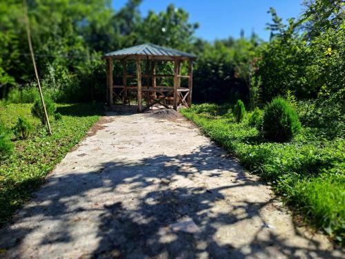 a path leading to a gazebo in a garden at Guesthouse Luka in Martvili